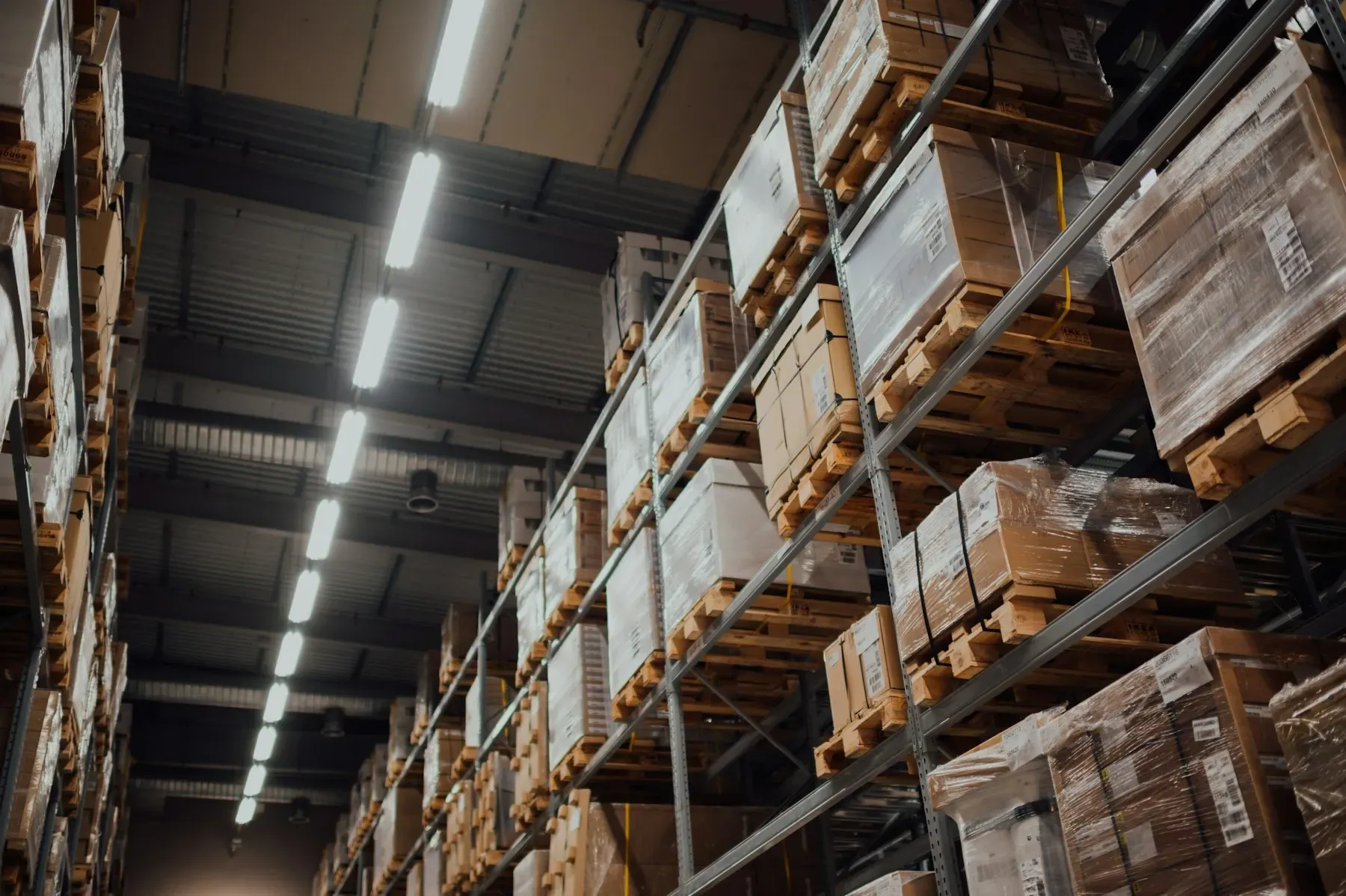 Warehouse racks with pallets and boxes